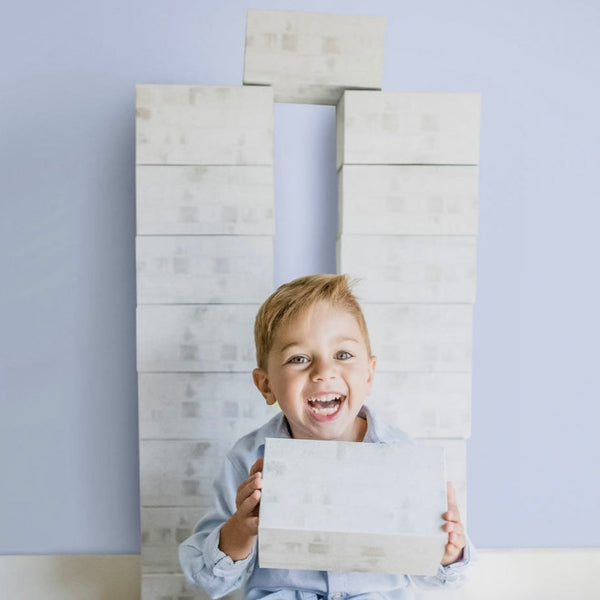 boy with white building blocks
